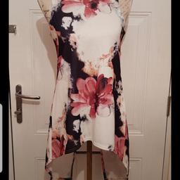 New with tags 
Beautiful Pink/White Top
Drops lower at back
Open back 
Lovely N Stretchy

🌟🌟 Plz see all photos 🌟🌟

👚👛🧥 Please take a look at my other listings 👖👙👗

👍👍Thanks for looking👍👍
🛍👛 Happy Shopping 🛍