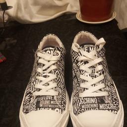 Size 6 Moschino black and white leather trainers. In good condition.