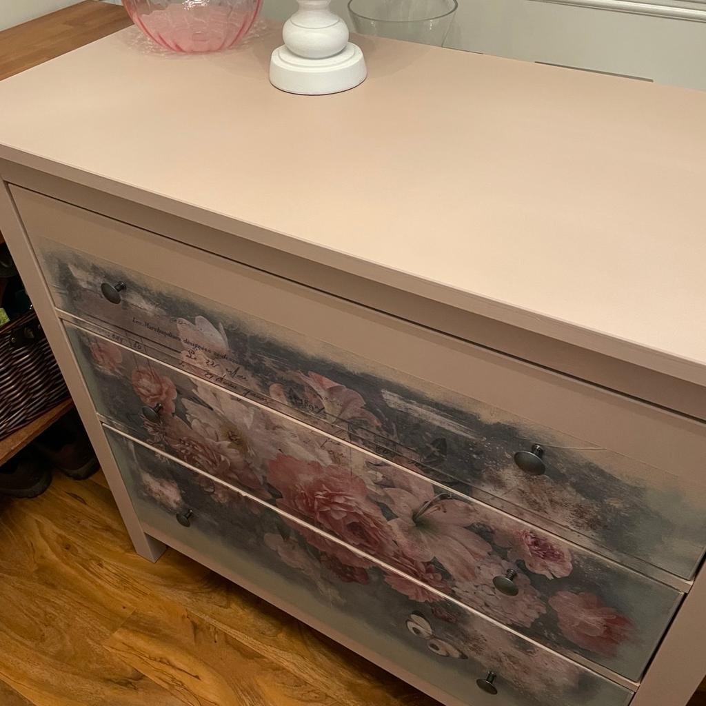 IKEA 3 draw cupboard. Has been painted in Frenchie nugget (pink) and deco parched with a flower design. The draws run very smoothly. A great cupboard for someone looking for something bespoke.