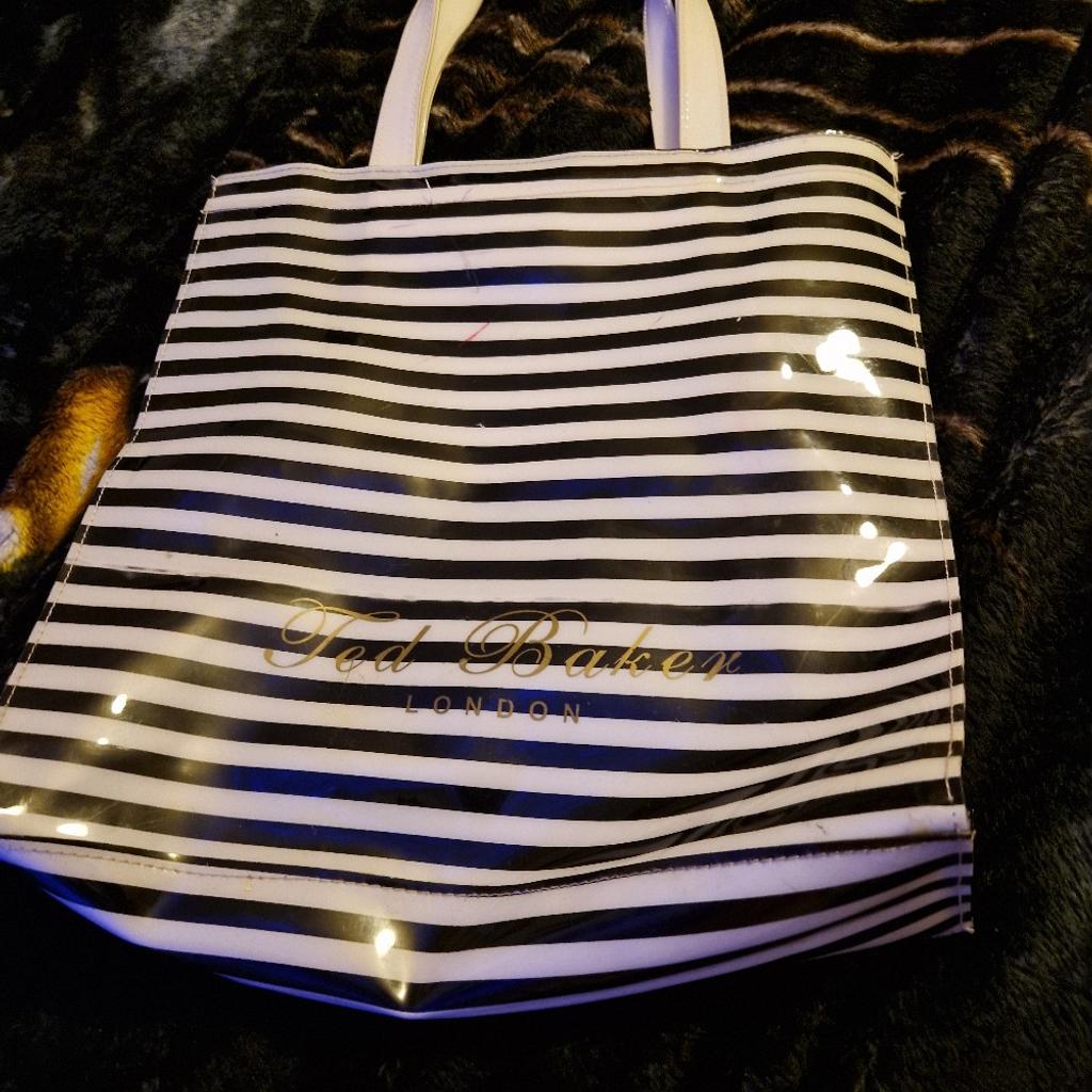 Large Ted Baker plastic/pvc bag tote/shopper
black and white stripes
inside zip compartment
few ink marks throughout