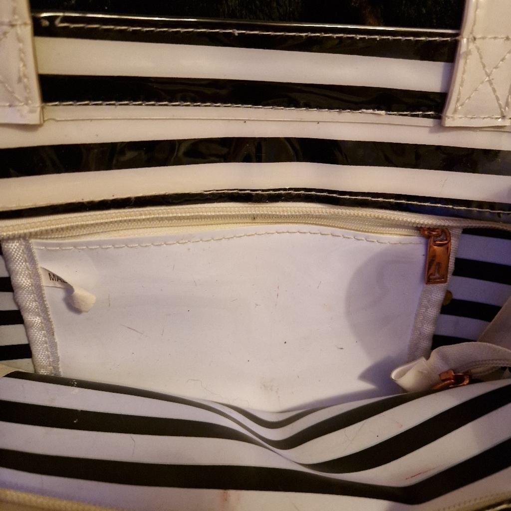 Large Ted Baker plastic/pvc bag tote/shopper
black and white stripes
inside zip compartment
few ink marks throughout