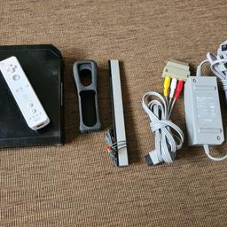 Wii console with remote and all cables.

Tested and working fine. Scratches and signs of use on the shell and the port flaps are missing.

Includes a few games that you are welcome to have.