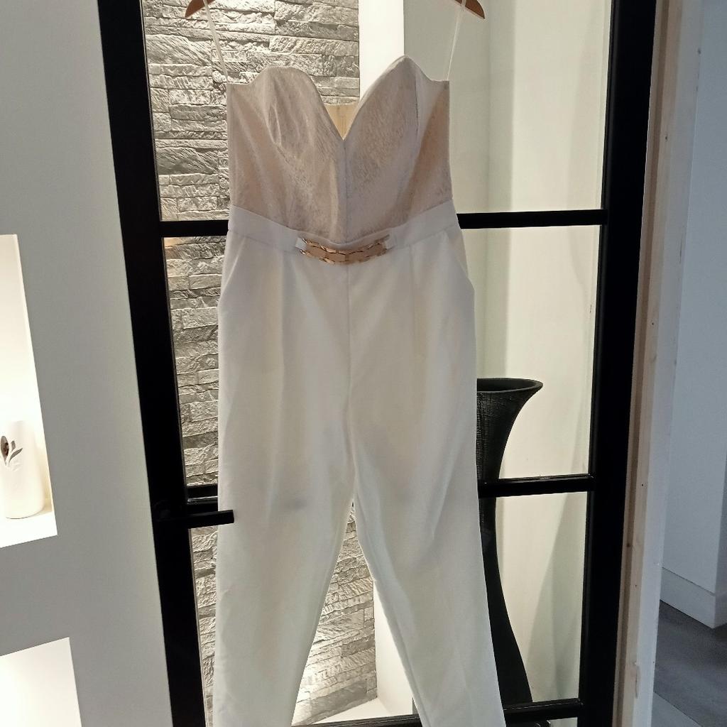 River island size 12 boobtube jumpsuit, cream with gold pattern top, zipped back, side pockets only worn once for wedding, great condition from pet and smoke free home DY6