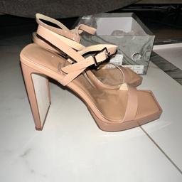 Jeffrey Campbell Danceria 2 Wall Heel Sandal (Women) Nude Patent Cow Leather, Size US 9 Uk 7

A sharply blunted toe and a perfectly flat wall heel bring smart geometries to a sandal styled to angle up the look of any ensemble at any occasion.

4 1/2" heel; 1/2" platform (size 8.5)