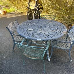 Large Round Cast Aluminium Garden Table And 4 Chairs 122cm Wide
This is a lovely large table, it has 2 matching chairs, and 2 different style chairs, all the chairs. have arms , 
cast aluminium with grapes pattern are on the table and 2 matching chairs
Needs a rub down and painting 
Please see photos for description 
Viewing welcome