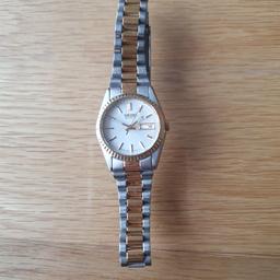 I have this really nice silver with gold Seiko womens watch, in great condition looks new hardly been worn, great for any occasions or for everyday use