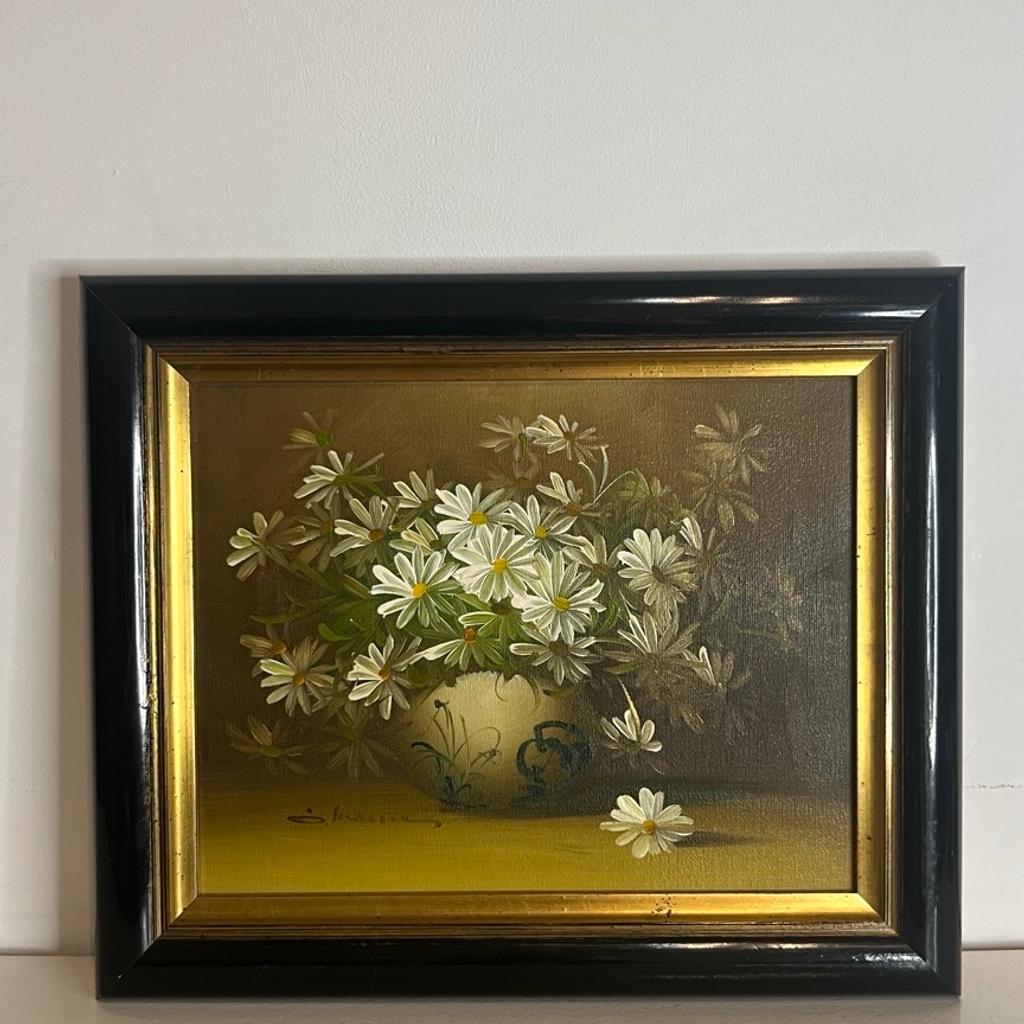 Stunning Signed Original Oil on Canvas Flowers Still Life Vintage Retro Painting Depicting Daysies in a Vase.
________________________

The artwork presents well. Minimal wear to the frame. This is a genuine vintage item, hence signs of history should be expected.

The frame measures 11” tall, 13” wide, and 1¼” deep (28cm x 33cm x 3.5cm).

Let's get this beautiful work of art to become a part of your home!

________________________
Free UK delivery included.

Message us for an international delivery quote.

10% discount if collected in person from N21 1NS, London, UK.
________________________

For more antique and vintage interior decor & fine art please visit our other listings.