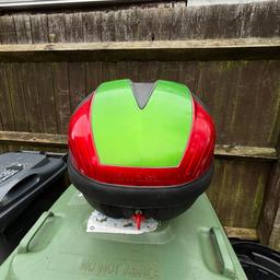 Genuine Kawasaki single helmet top box with a detachable mounting plate