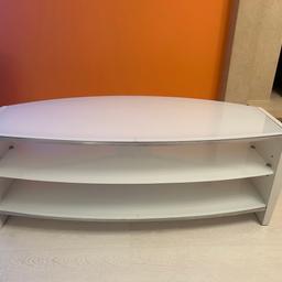 Beautiful white TV stand from John Lewis. Features a white glass design with chrome details, curved edges, very modern. Extremely heavy piece of furniture, well made and sturdy. No visible marks or scuffed, has been well looked after and cleaned consistently. Stand was used for a 59” TV.

Quite heavy so please ensure you have a car big enough to fit / carry this.

Originally purchased brand new from John Lewis a couple of years ago for £329. Open to reasonable offers.

Measures approx 110cm (W) x 47cm (D) x 40cm (H)