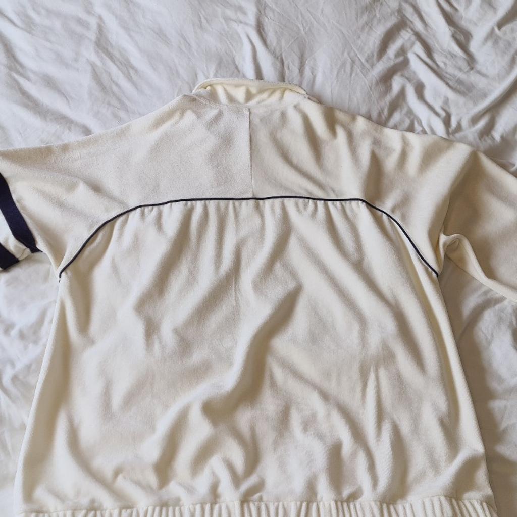 Fila Soft Touch Track Suit Top. 2xl. Very Retro Similar To Worn In Sopranos Etc. Light beige/ light cream colour. 1st to see will buy. Fila Soft Touch Track Suit Top. 2xl. Very Retro Similar To Worn In Sopranos Etc. Mid cream, almost yellow in colour. 1st to see will buy. I am selling for a friend so please be sure to scrutenise the photos as this is sold as seen in photos, plenty of which are provided. See photos for condition size flaws, etc. I can offer try before you buy option but if viewing on an auction site viewing STRICTLY prior to end of auction.  If you bid and win, it's yours. Cash on collection or post at extra cost, which is £4.55 Royal Mail. I can offer free local delivery within 5 miles of my postcode. Listed on five other sites so it may end abruptly
Please note I have 2 Fila Soft Touch tops so please make sure you choose the correct one.
Ps. I've just watched the first episode of Netflix's new gangster series called 'The Gentlemen' and the main villain is wearing a v