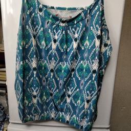 lovely top to small it's turquoise and green size 18.
