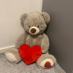 Large beautiful teddy with red heart