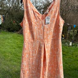 Gorgeous new next spring dress. NES with label attached not worn. Lovely apricot skater style dress with pretty white details. Lovely dress for spring summer.