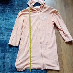 From Primark kids size M (I would guess roughly 8-10 years) . Orange zip up towelling robe. Similar style orange bucket hat. Both been worn but still ok. Collection only please.