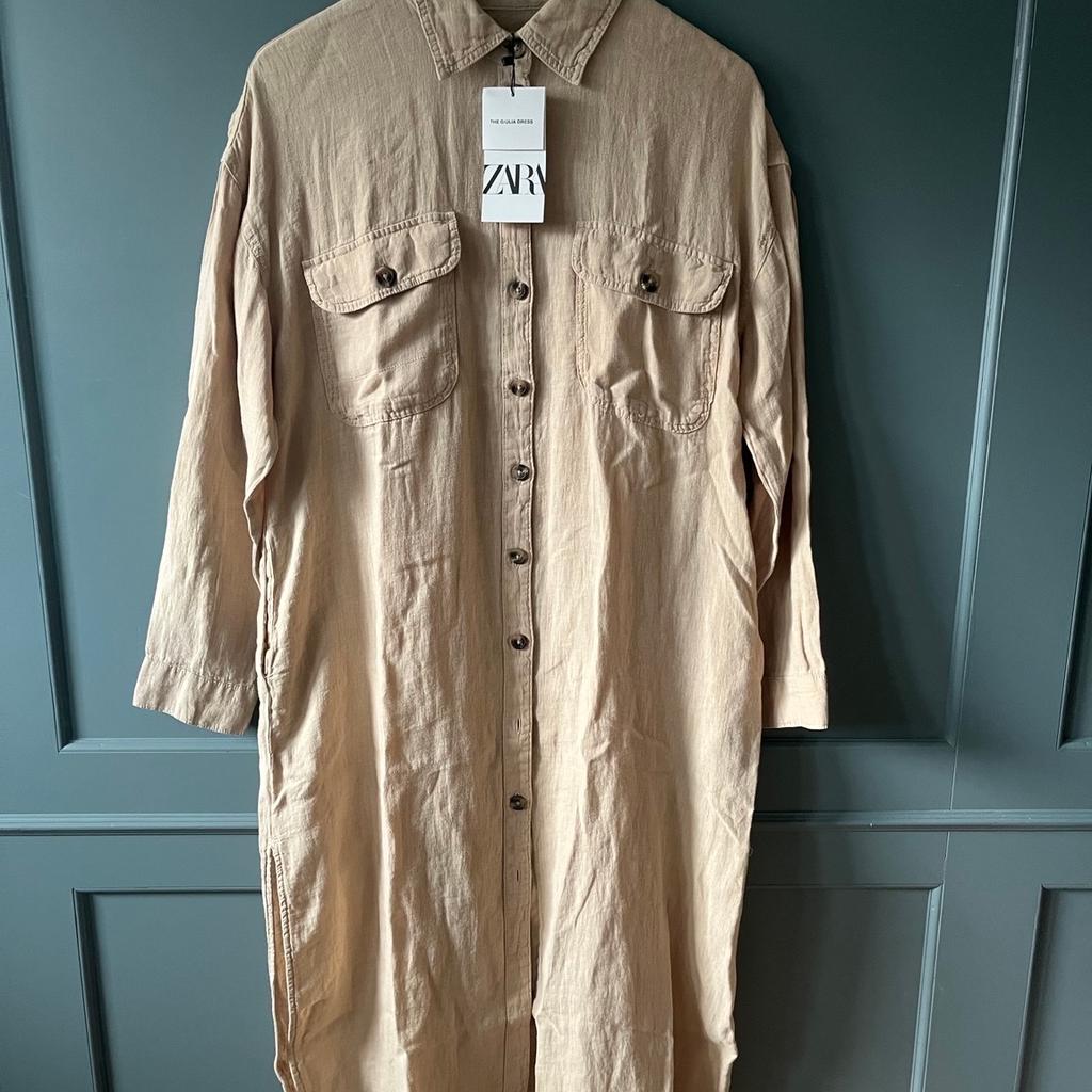 Midi dress made of 100% linen. Lapel collar and long cuffed sleeves. Chest patch pockets with buttoned flaps. Hem with side slits. Button-up front.
Wear on its own or open buttons over t-shirt.
This does have an oversize fit.
Colour - Beige
Code - 8367/046
COMPOSITION
100% linen

Check my feedback and purchase with confidence. Many thanks for looking 💕