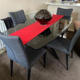 Recently purchased for over £1,000 this is a beautiful table complete with 4 chairs. This is in immaculate condition and only selling as moving into a retirement home and just don’t have room for it unfortunately. Unique metal legs and black glass top in perfect condition.

I will reply quickly to any messages on here. Mobile signal can be bad for me so please message on here or on the mobile if you can’t get through.