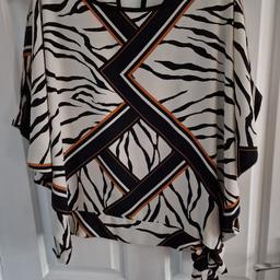 Off the shoulder top from Dorothy Perkins size 14. With tie side. In great condition.