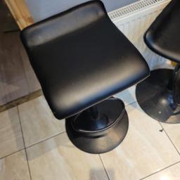 8 breakfast bar stools used and one new adjustable height with black steel base cushioned seats selling due to house move