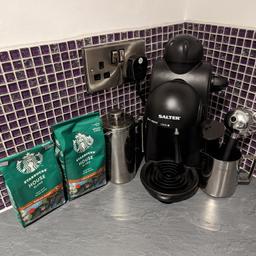 Coffee machine with milk frother caftiere accessories and a bag of ground coffee