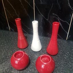 3 vase set 
2 reds and 1white.
2 round candle holders 
candle holders have slight colour chip from the top but not tht noticeable. see pic
no offers