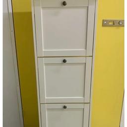 Tall Slimline Compact Shoe Storage Cupboard in white.  Approx 130cm tall 50cm wide 26cm deep.  The Item is used so it has some cosmetic marks. SEE ALL PICTURES