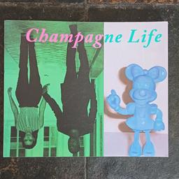 A programme from the exhibition "Champagne life " showcasing Female artists put on at the Saatchi gallery a few years ago. 
Good Condition.