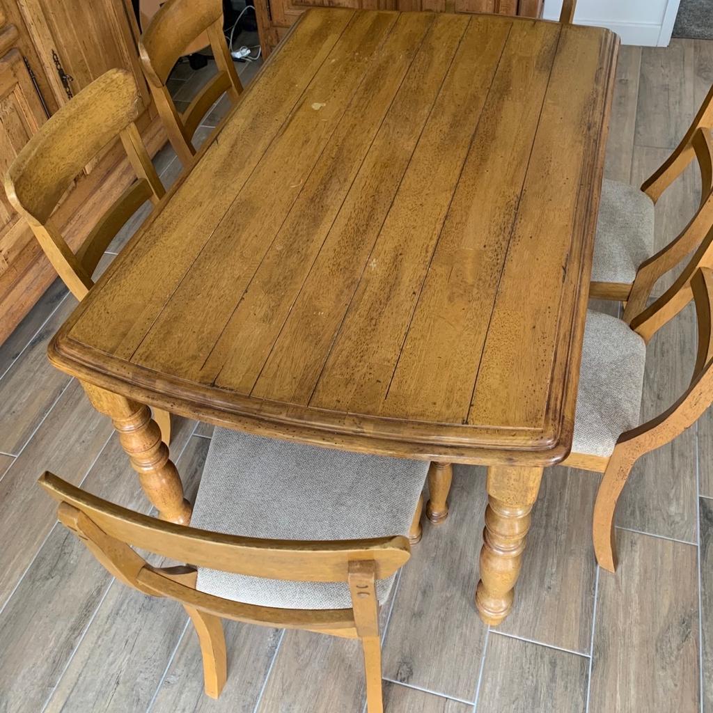 This is a distressed farmhouse oak family dining table and chairs purchased from Arighi Bianchi minor marks on chairs due to storage