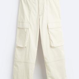 Zara relaxed cargo trousers with contrast made of thecnical fabric. Elasticated waistband. Fron and back pockets. Contrast topstitching all over size S RRP 49.99.