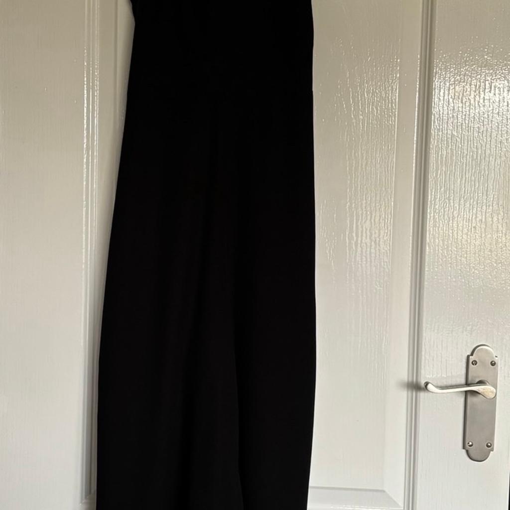 Warehouse Cropped Dungarees/Jumpsuit. Side zip, cut out back. Can be worn on its own or with a top underneath. Looks great either dressed up with heels or dressed down with trainers. Size 12. Only worn a few times
