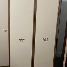 Height: 6ft
Width: 29.5inch
Depth: 22inch 
Cream and brown wardrobe with gold handles few marks of wear and tear but nothing major