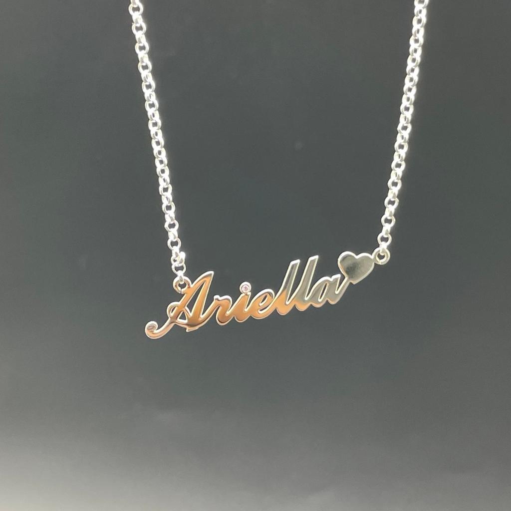 A custom made 925 sliver name plate pendant with an along attached with a 925 sliver 16inch belcher necklace!

1 crystal colour stone of your choice!

All you need to do is send us your name and will we get it done!

Please note that the process takes around 10 working days to complete.

Any questions please contact me!

Siwatchesandjewellery