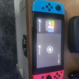 Nintendo switch including 2 games carry case charging Dock excellent condition