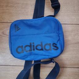 Small Adidas cross body bag with adjustable strap & zip pockets. Excellent condition.