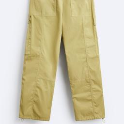 Zara relaxed cargo trousers with contrast made of thecnical fabric. Elasticated waistband. Fron and back pockets. Contrast topstitching all over. Size S RRP 49.99
