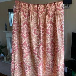 Pair of professionally made, made to measure, weighted and fully lined curtains in Terracotta and cream patterned, slubbed chenille material. 

Headings are triple pinch pleat, trimmed with decorative material buttons. 

Dimensions (each curtain):

1m 40 cm drop x 1m 30 cm width (pulled width 75cm currently). 

Including matching edged, lined and stiffened tie backs (38cm long) with button detail , complete with circular fastening hooks. 

Matching single, fully lined patterned door curtain with tie back is also available (2.03m drop x 4.00m width). 

In good condition from smoke free home. 

Buyer to collect from Bingley.