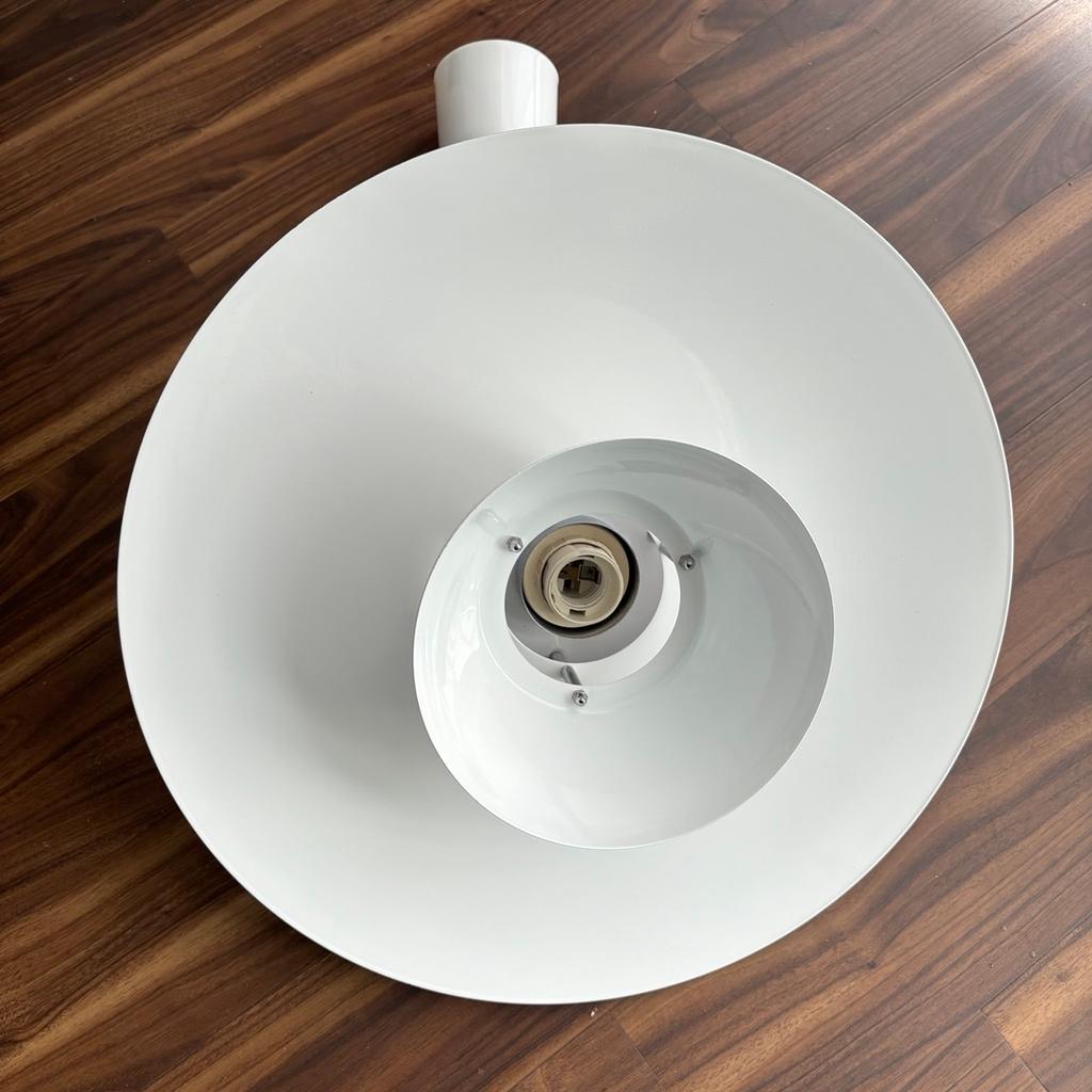 This budget rise and fall pendant is ideal for installation above a dining room table or breakfast bar area. The light fitting can be pulled down or pushed up allowing you ambient lighting when required or kept out of the way when not needed. The maximum drop of the light and flex is 1.3 metres (1300mm) when fully extended. When pushed up and out of the way the minimum drop is 560mm.

White metal shade with two layers in a Scandi style with chrome detailing. The shade is easy to wipe clean if used in a kitchen.

Can be used with any E27 lamp up to 60 watts. Compatible with LED and energy-saving lamps.

Usual price for these is £120