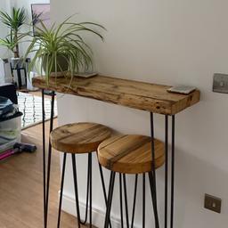 Handmade reclaimed wood breakfast bar top (L91cm D28cm, 6cm thick).

Two matching stool tops (35cm diameter, 6cm thick.

Table top has pilot holes for 2x hairpin legs (three pin); pilot holes for bracket to fix to wall.

Stools have pilot holes for 4x hairpin legs (two pin).

Includes wall bracket for table top as pictured; to note legs and screws not included
