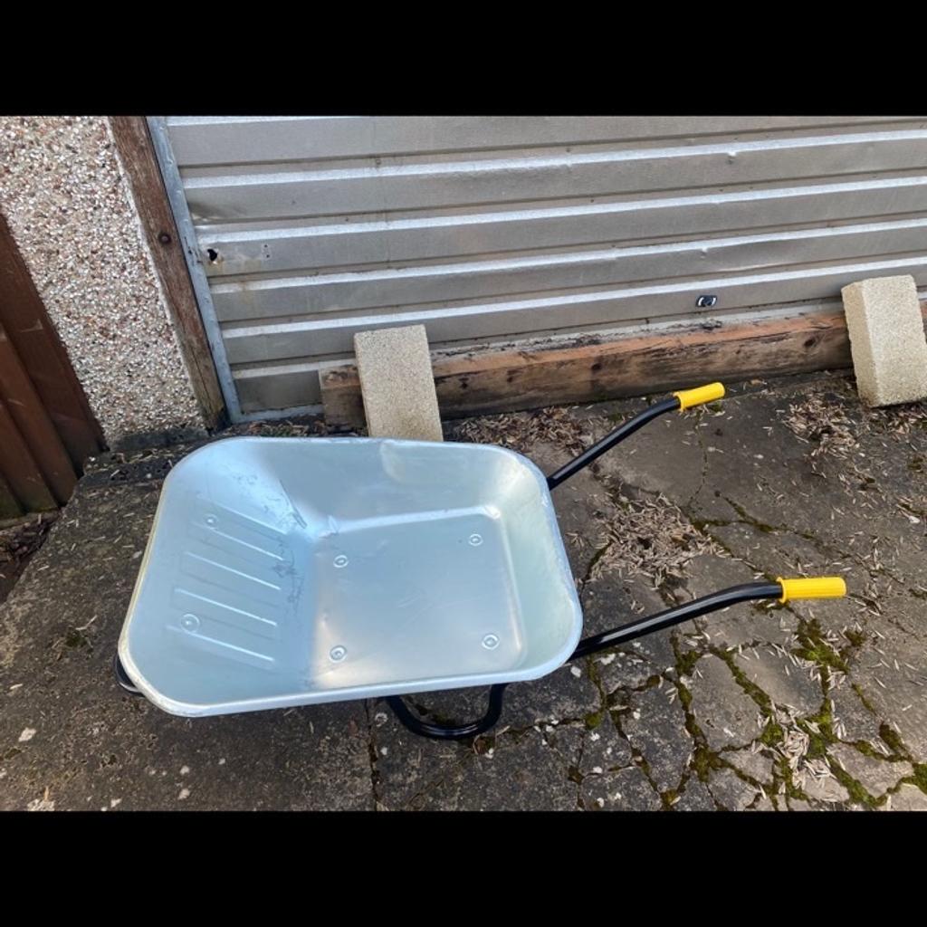 Here we have a new wheel barrow some marks due to storage grab a bargain