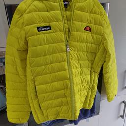 Ellesse puffer style jacket with hood in size medium though seems like a slim fitting so would be fine for someone who is small size. Yellow in colour and worn only once from a smoke-free home