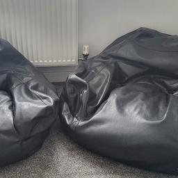 2 black leather look bean Chairs. no longer needed. both need topping up. £18.00 each. please collect.