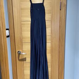 My daughter’s prom dress only worn once and immaculate condition. Navy blue, lovely material, has a train and slit.