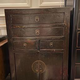 Antique cabinet with dark lacquer. Height 90cm, width 62.5cm and depth 37cm. 4 drawers and a cupboard.