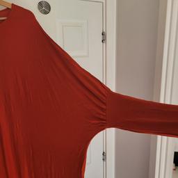 very long new dress. 
burnt orange.  can be tired up to look like a top .
one size