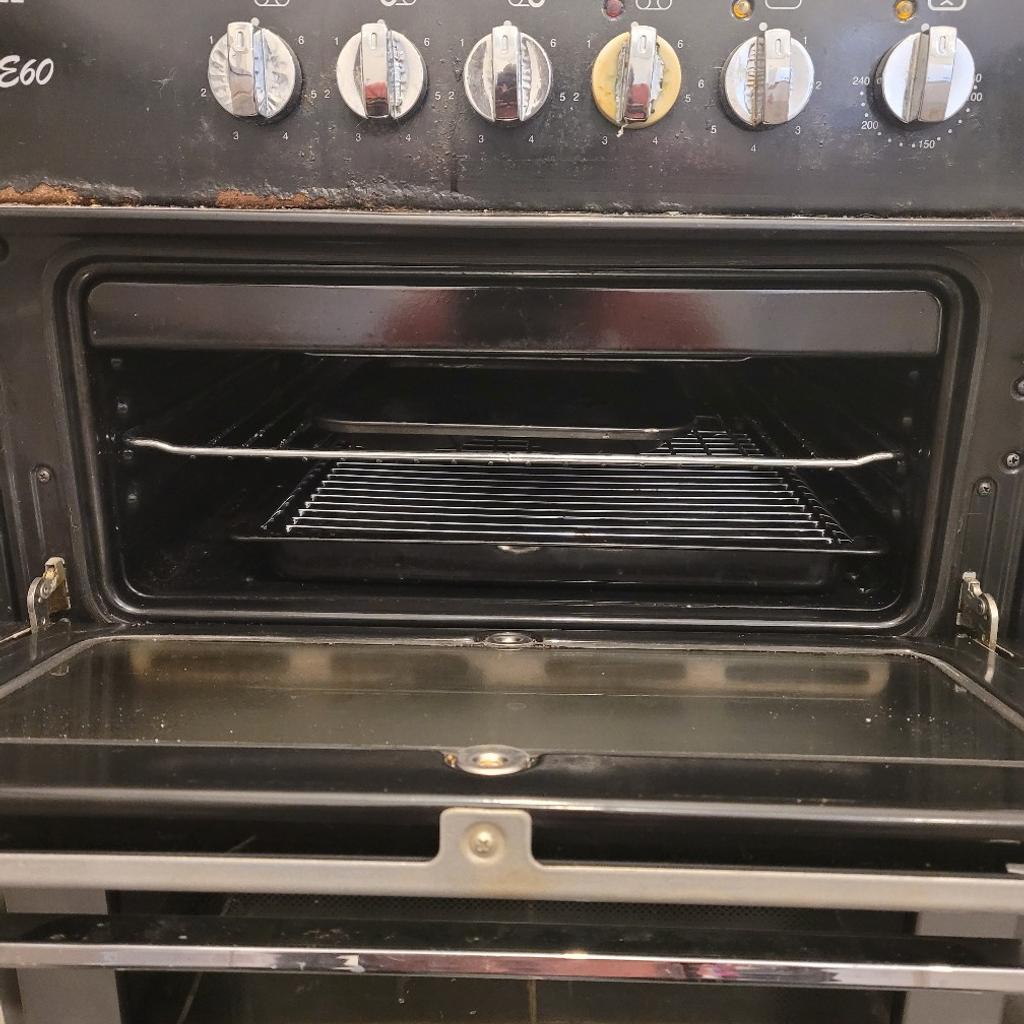 Brand Flavel, Model Milano E60, Black and Silver freestanding electric cooker. Has a glass ceramic hob with 4 burn discs, separate grills, and oven. Everything works fine. The only issue the oven door hinges need seeing too, but closes fine.

Possible local free delivery and installation, but terms and conditions apply. Contact me for further information.