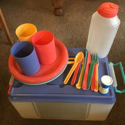 Picnic box with 4 x plates , cutlery for 4 people, 3 x cups and salt/pepper pot plus drink container.