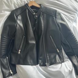 Zara black leather jacket, never worn but no tags. Great condition and zips are fine. Thick and warm inside, slightly cropped style.