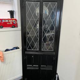 side corner wardrobe black color good very nice condition, but the one problem is the one window have is not close because break in somebody pick up and buy new something and then fix it then look like nice lightweight and black color