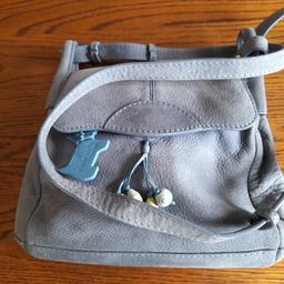 A beautiful Radley handbag used but well looked after,this is a grey and blue tone in colour ,the inside has no marks at all.three inner pockets pluss a small pocket. also a pocket on the back of the bag,,a magnetic closeure. Measuring 10 by 8 inches approximately.PayPal or bank transfer or collection, postage to be paid.