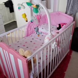 Pink and white cot comes with new mattress and bumper set. Mobile not included 