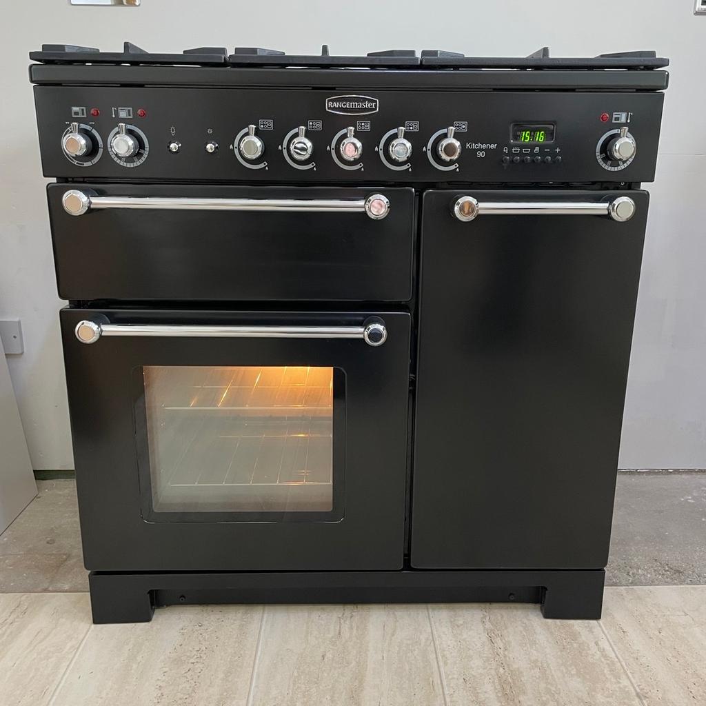 Rangemaster Kitchener 90cm dual fuel Range Cooker in Black.

Main electric fan oven - capacity 79 litres, 2 removable shelves, oven light,
Glass fronted door. Main oven cleaning - catalytic liners.
Tall fan oven - capacity 67 litres, 4 removable shelves & 8 shelving positions, solid door.
Top grill with pan & rack.
4 gas rings with 1 multi ring burner ideal for wok cooking. Pan supports are cast iron and dishwasher safe.
Width 900mm
Depth 604mm
Height to hot plate 905-930mm
Comes complete with Users Guide, tool and set for LP gas.
This oven is in very good clean condition from a pet and smoke free home.
Collection only.